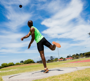 Man competing in shotput.