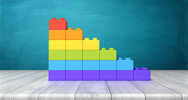 A stack of building blocks descending in height from left to right.