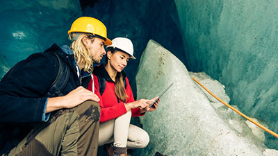 Environmental scientists studying the formation of glaciers.